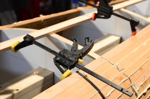 Here the clamps are reversed to push against the maple keel.